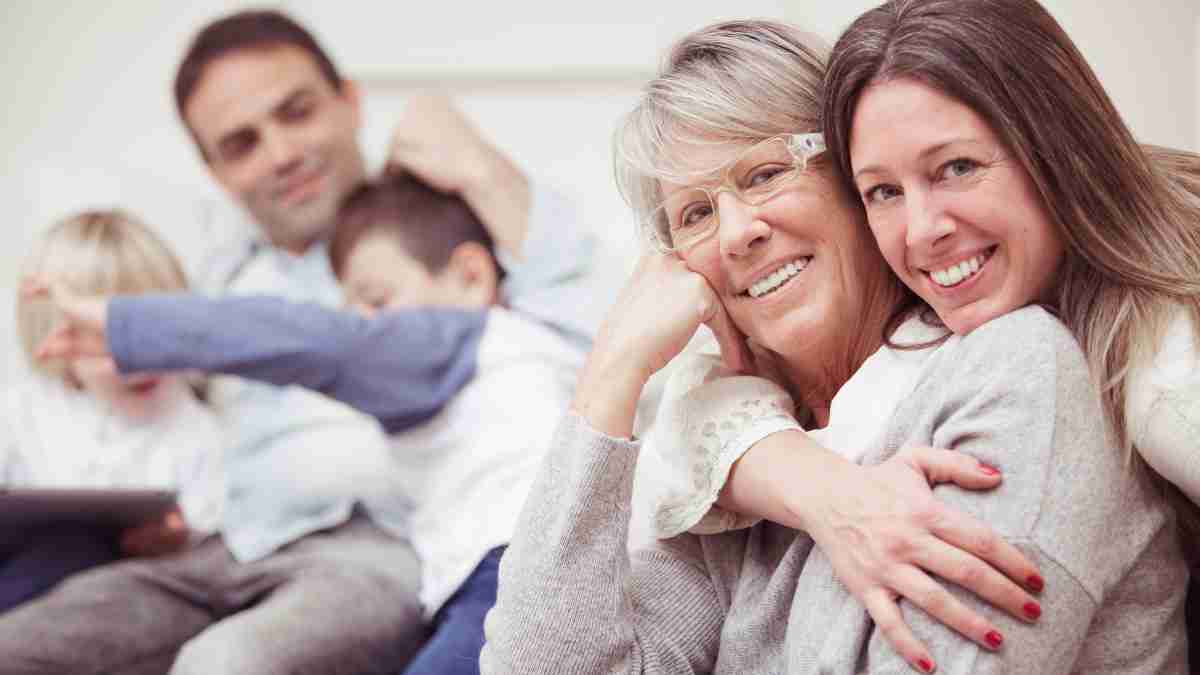 A family smiling and hugging representing a family trust in estate planning